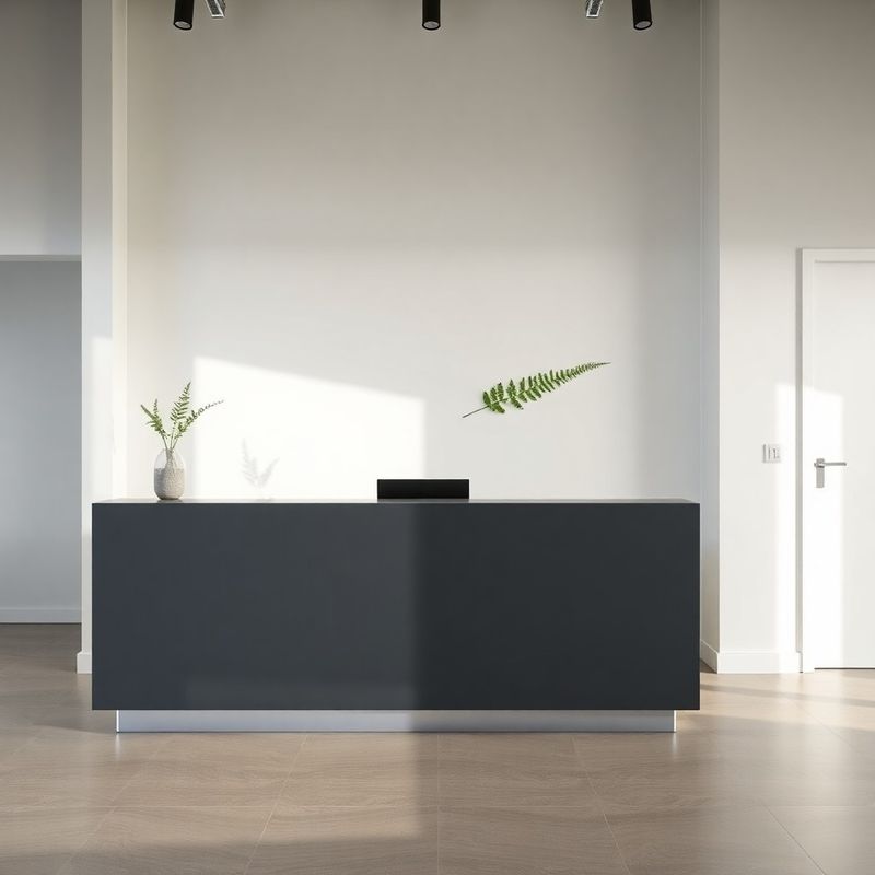 Reception area of a professional New Zealand office with slate-grey finishes and a fern detail